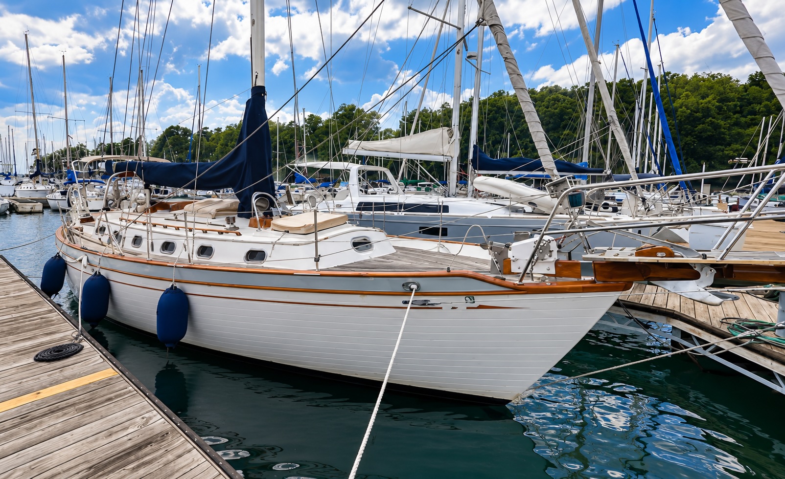 Sailboat at dock with blue trim